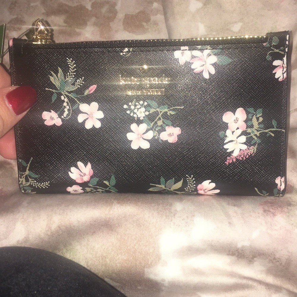 Kate spade wallet 5 1/2”W x 3 1/4”H x 1/2”D.
